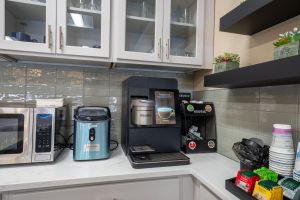 Colorful dessert table featuring a variety of fruits, cakes, and floral decor, ideal for celebrations.